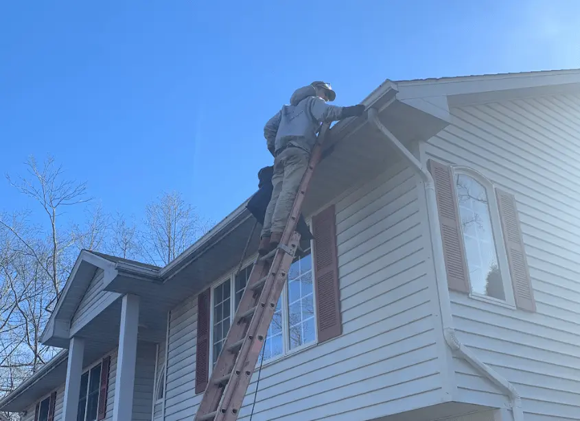 Gutter cleaning and maintenance being performed by Solon Power Washing in Solon